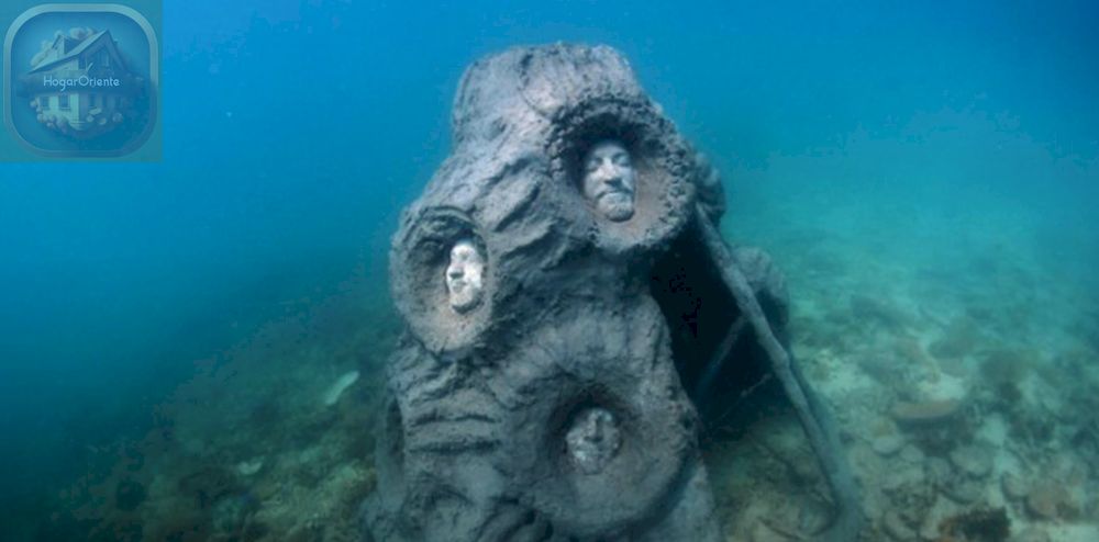 arrecife de coral submarino escultura tres cabezas